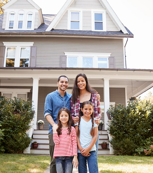 Family in front of home